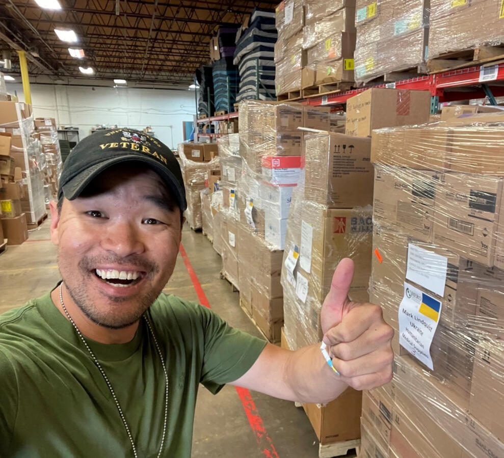 Mark J. Lindquist pictured next to pallets of medical supplies he delivered to Ukraine Mark J. Lindquist pictured next to pallets of medical supplies he delivered to Ukraine